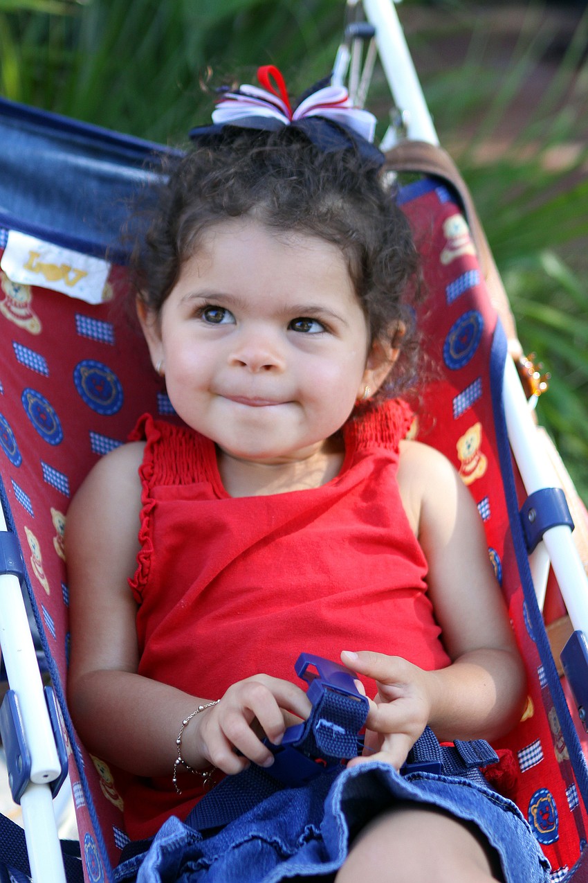 Ashley Auler, 2, gets ready to watch her first parade.