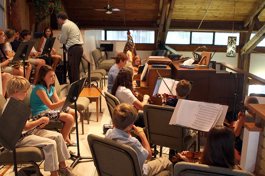 The Lower School Orchestra warms up Friday, June 3 prior to the beginning of ODA's 6th grade graduation at Siesta Key Chapel.