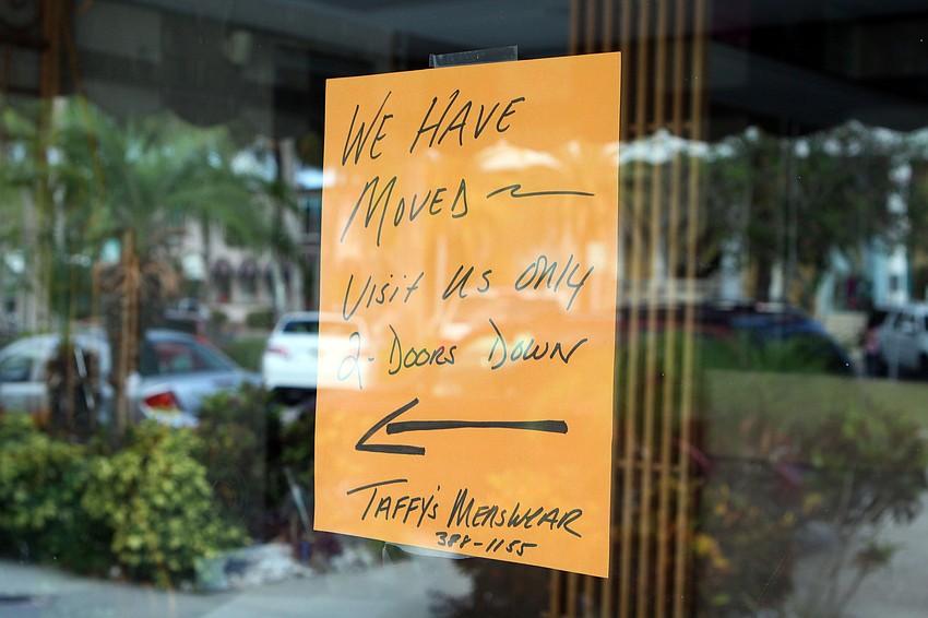 A sign on the old Taffy's store front to let customers know where they have moved to.