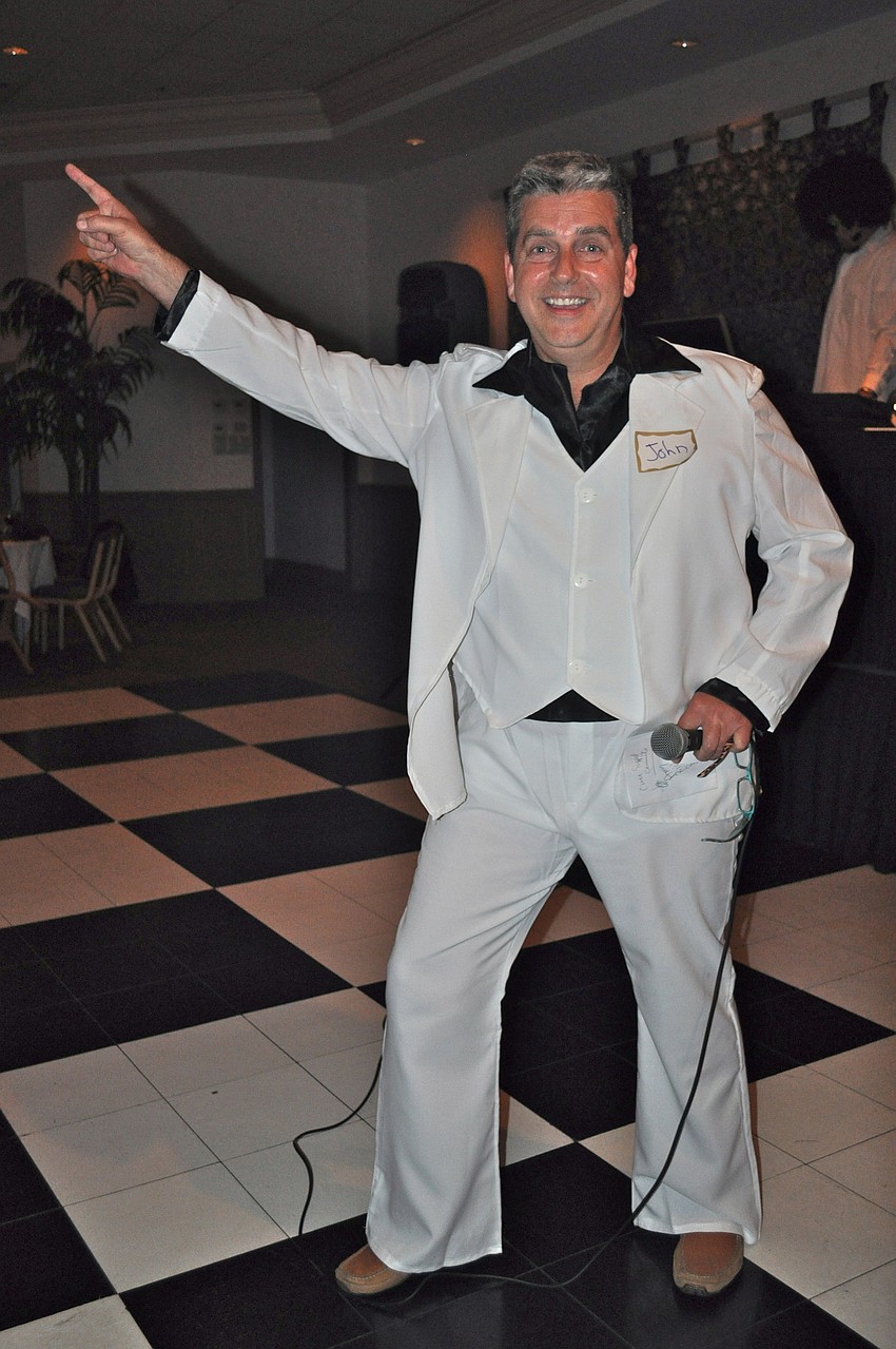 Siesta Key Kiwanis Club President Gary MacDonald strikes a pose on the dance floor.