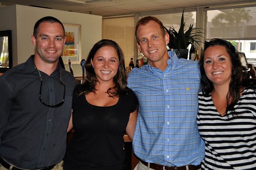 Greg Witt, Gabriele Vest, Tom Rees and Anne Weiser pose together Friday, June 17 at the wrap party following the YPG Annual Conference/SUM+ at the Hyatt Regency Sarasota's Boathouse.
