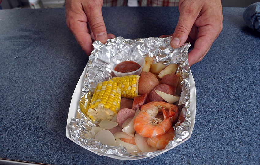 Maggie's Seafood's low-country shrimp boil â€” a New Orleans-style dish that includes shrimp, potatoes, sausage, corn and seasonings.