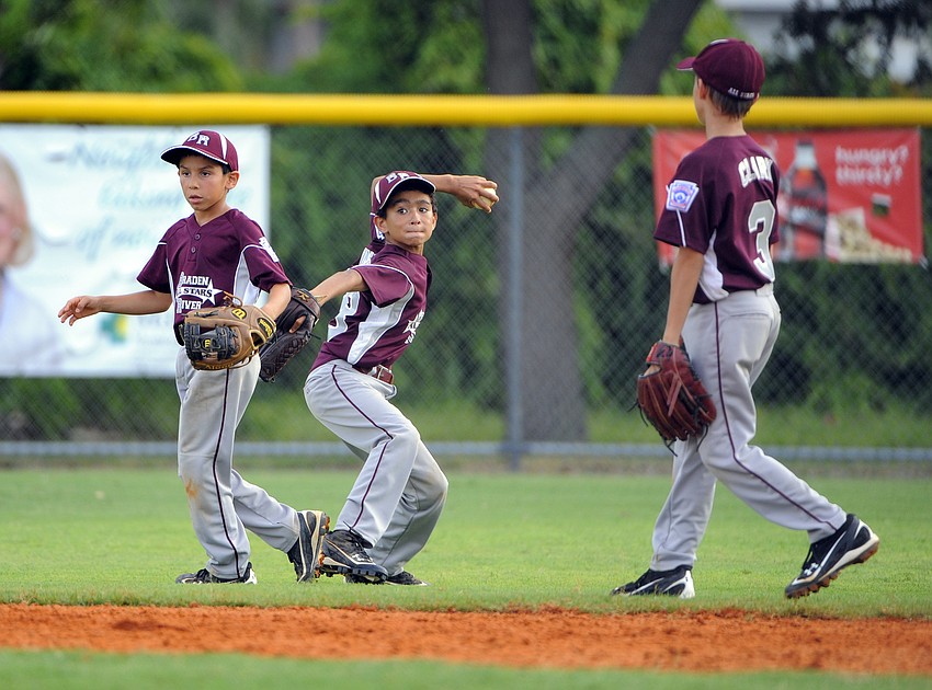 Austin Brinling fields the ball cleanly and looks to keep the opposing runner from advancing.