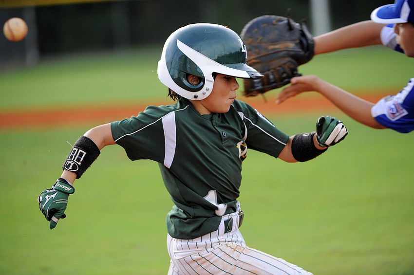 Lakewood Ranch Little Leagueâ€™s Ben Tobio beats the throw to first base.