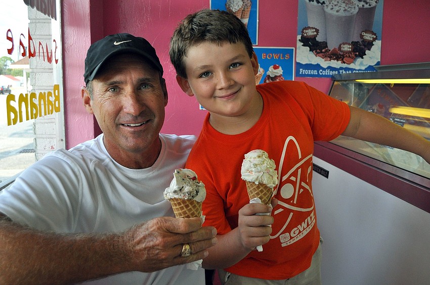 Mark Wetzel and Jonathan Jetton, 8, enjoy some ice cream during a Big Brothers Big Sisters social event Tuesday, June 21 at Big Olafâ€™s Ice Cream on Bahia Vista.