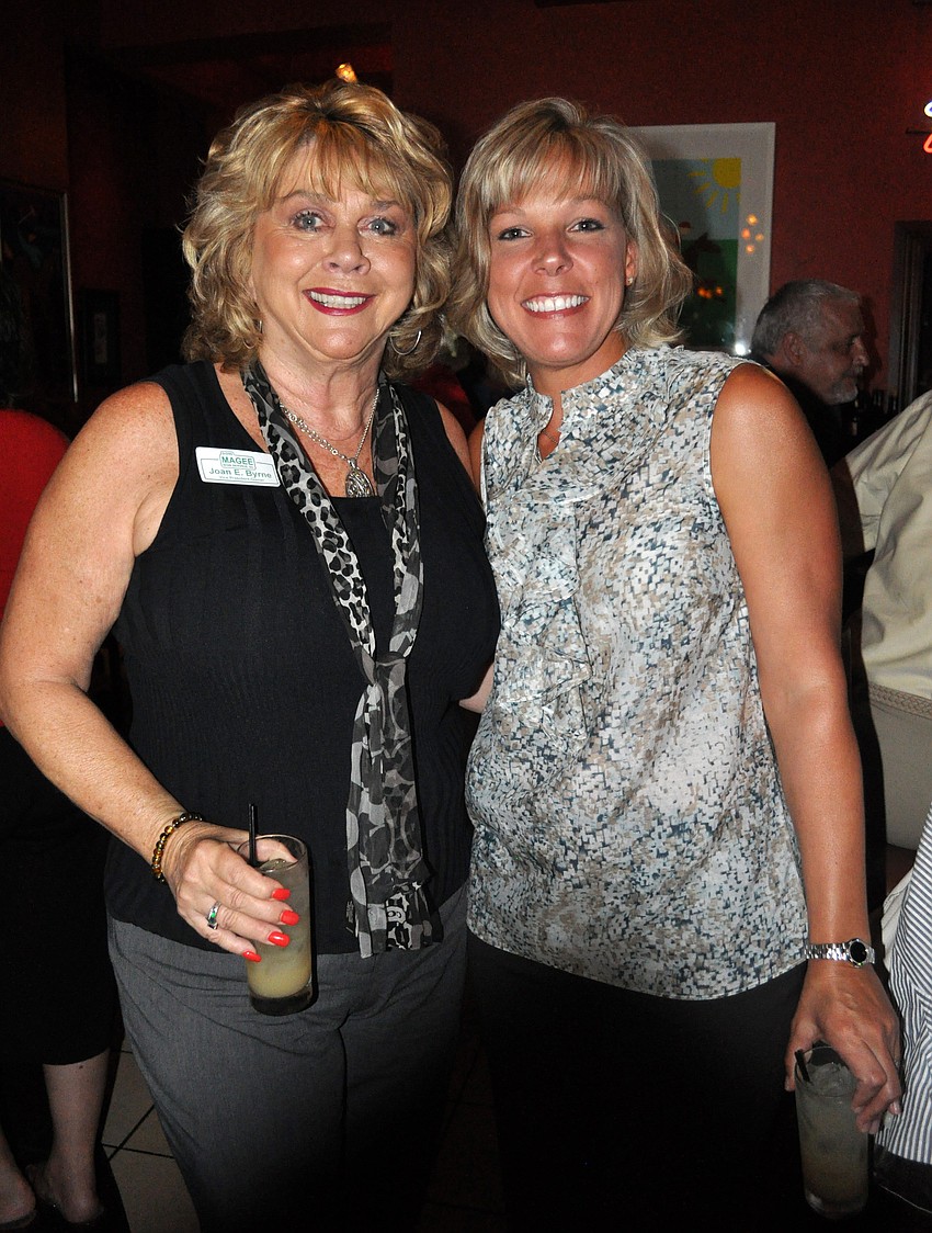 Joan E. Byrne and Crystal Fischer enjoyed the opportunity to network while participating in a charity event.