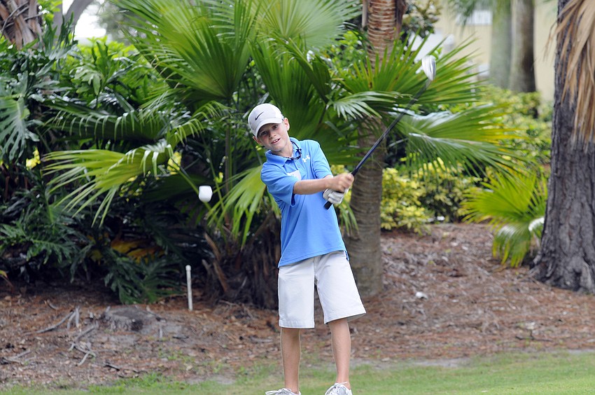 Nine-year-old Robby Goecker spent ample time working on his pitch shot July 13.