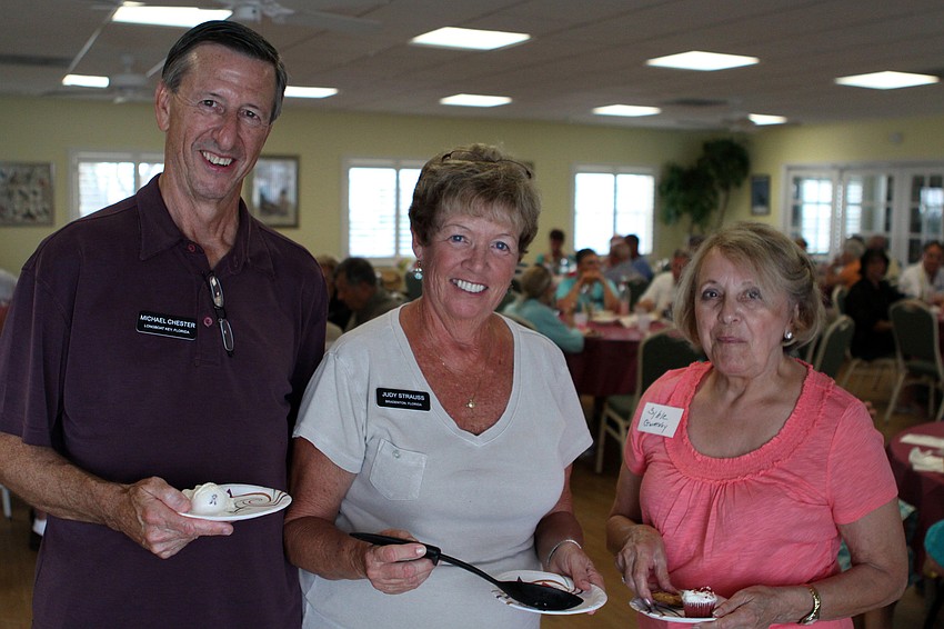 Michael Chester, Judy Strauss and Syble Gwatney get some dessert Saturday, July 16 at the Christ Church and Spanish Main fish fry.