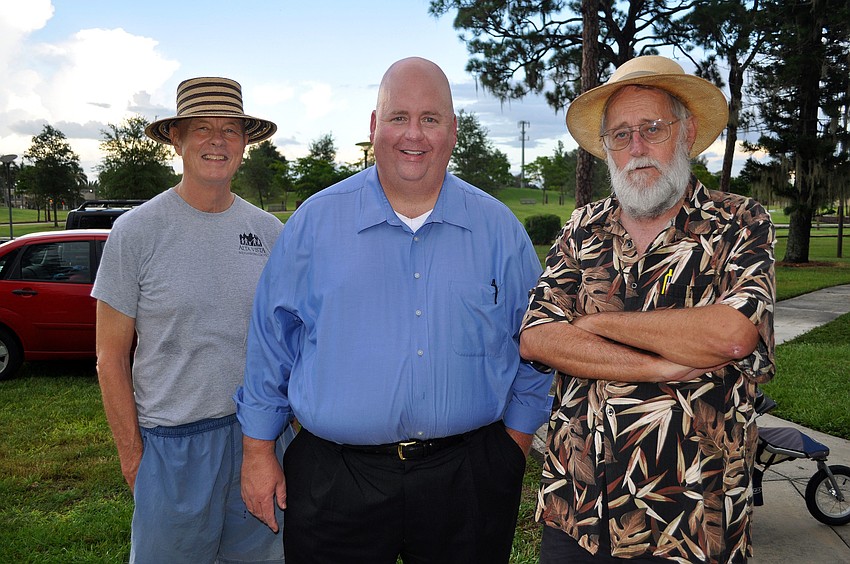 Craig Noren, Shannon Snyder and Stan Zimmerman enjoy themselves Thursday, July 28 during the Alta Vista neighborhood picnic at Payne Park.