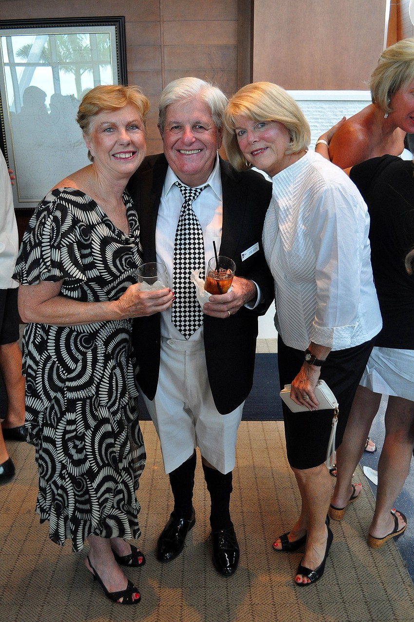 Mary and Jym Agen pose with Meredith Slavin