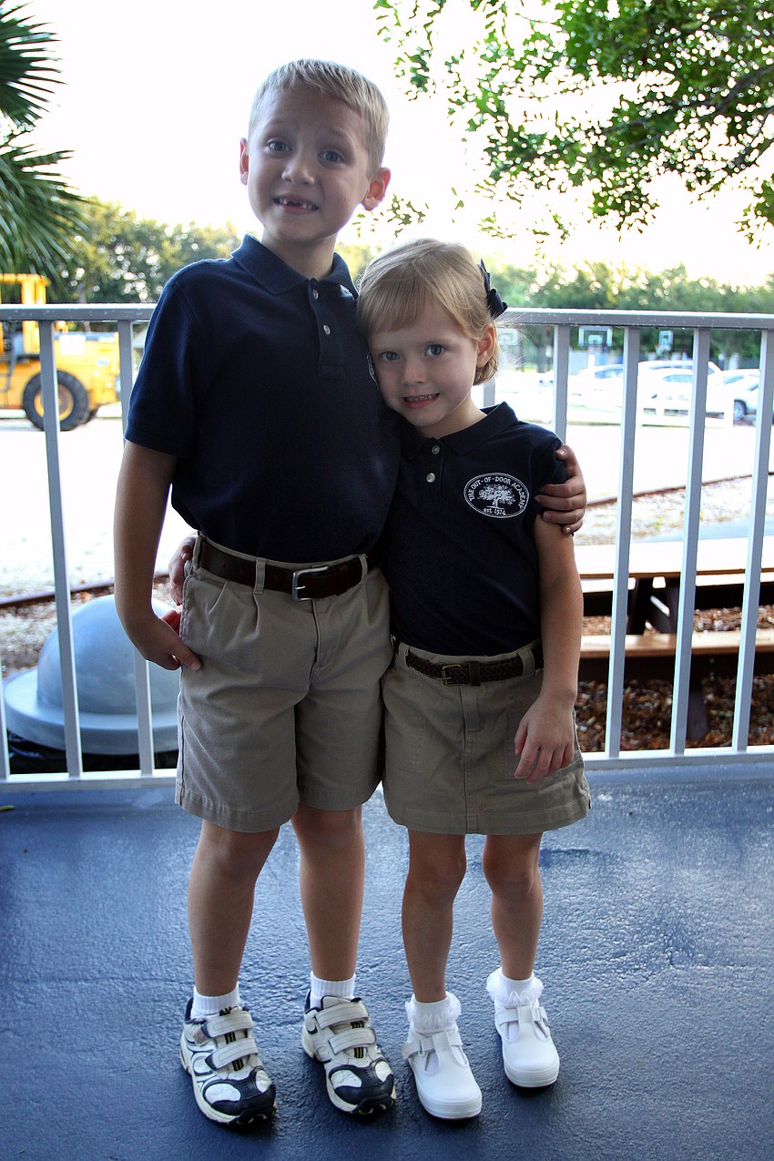 Cal, 5, and Nicole, 4, Hengel pose together Wednesday, Aug. 24 at Out-of-Door Academy.