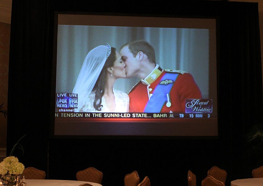 The first kiss between the newly wedded Duke and Duchess of Cambridge Friday, April 29 was shown on two large screens during the royal wedding celebration at the Ritz Carlton.