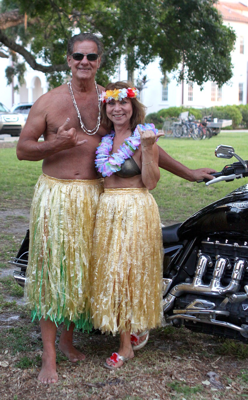 Dennis Dallas and Susan King dressed in homemade Hawaiian attire to Ashley King's graduation ceremony from New College Friday, May 20 at College Hall Bay Front. King will be moving to Maui after graduation.