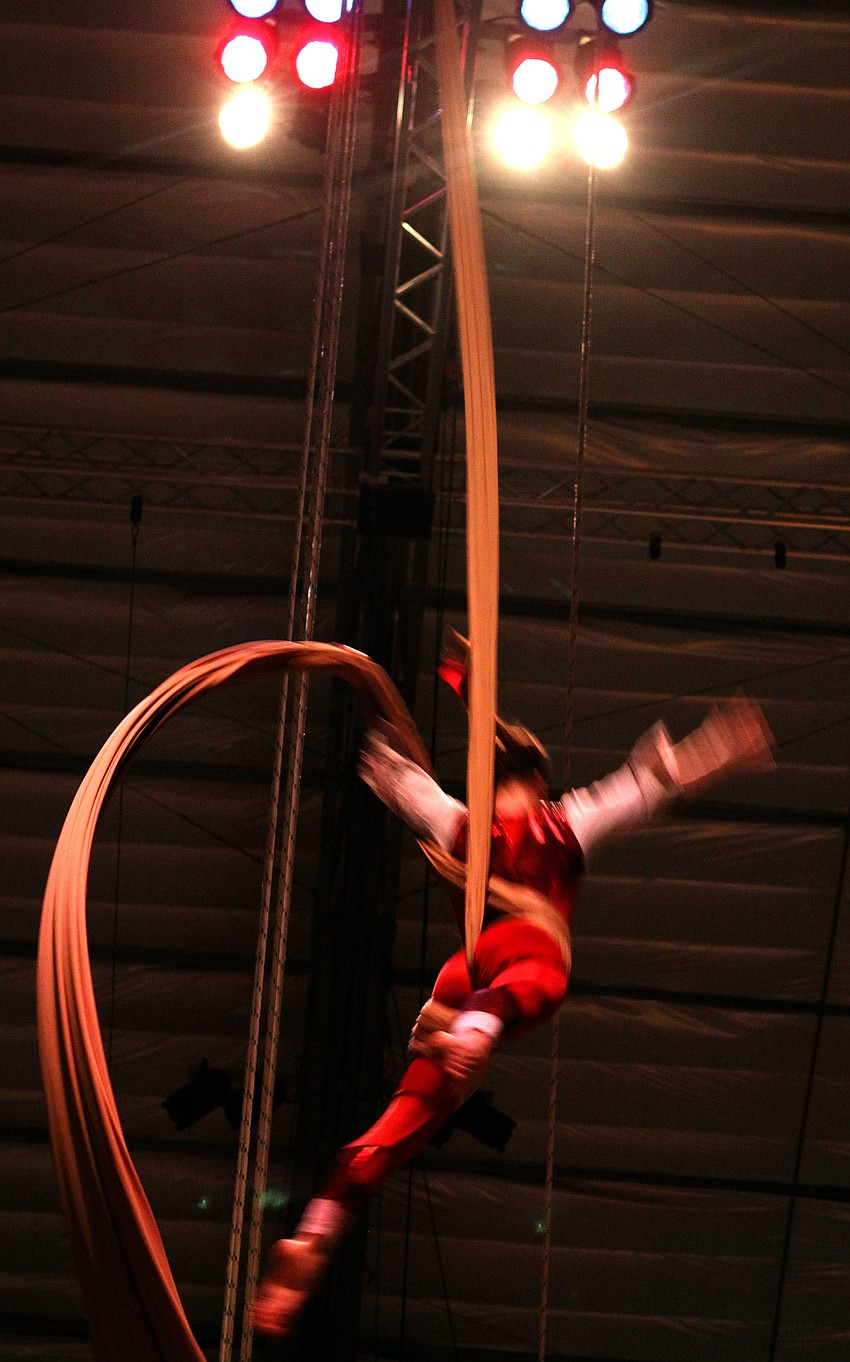 Shena Tschofen of Circus Juventas of St. Paul, MN comes twirling down her silk rope during the American Youth Circus Organizationâ€™s showcase performance Thursday, Aug. 18 inside the PAL Sailor Circus Arena.