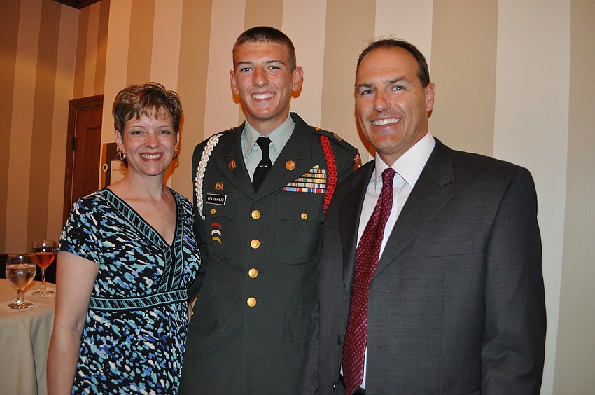 Alex Weatherhead of Palmetto High School, center, is pictured with his parents Leslie and Jeff.