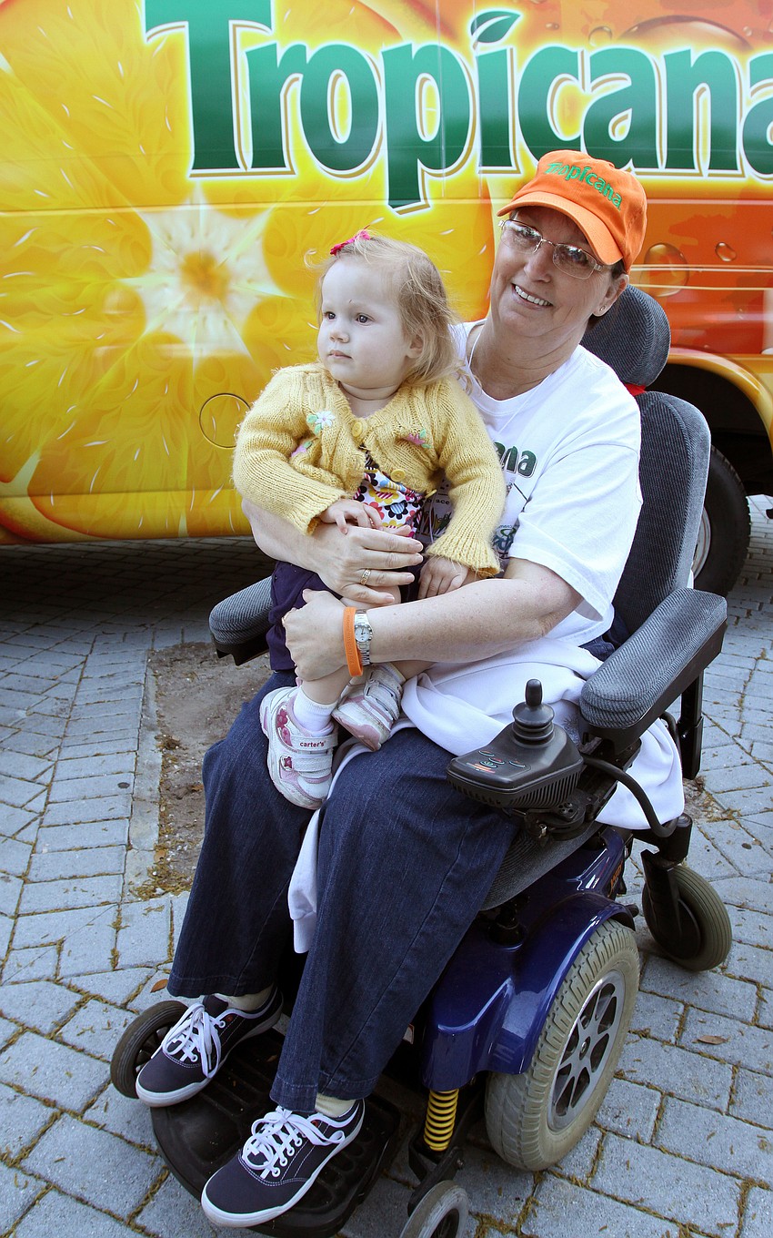 Candy McCaskill holds her grand-daughter, Lydia Roman, 2, on her lap on Saturday, March 19, at J.D. Hamel Park.