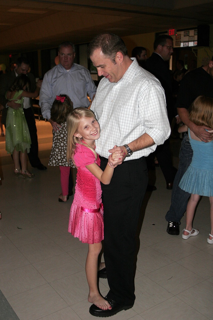 Third-grader Sarah Huston enjoyed a special dance with her father, Glenn.