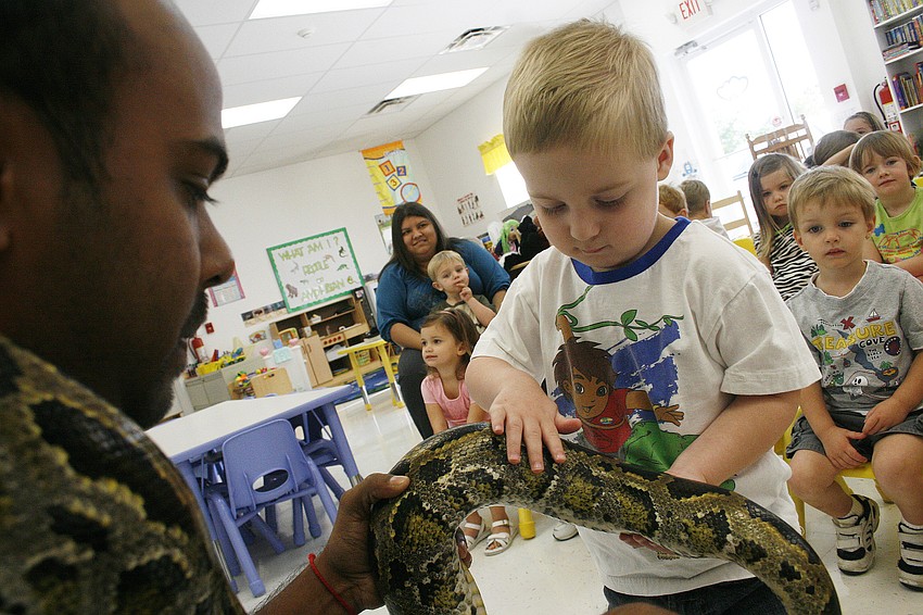 Jacob Cunningham was the first student to touch the Burmese python.