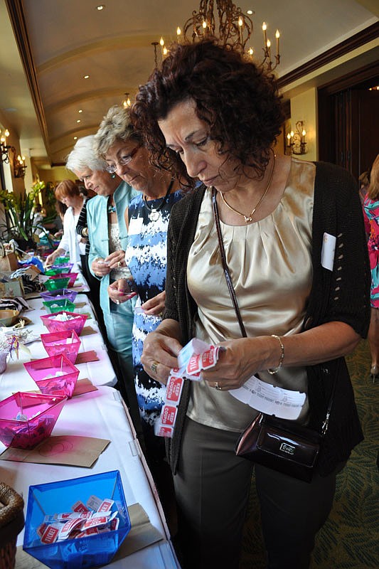 Phyllis Fox checks out the raffle items.