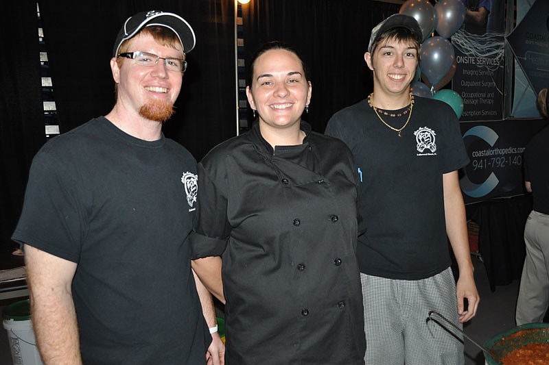 Cory and Lorraine Collins and Justin Damato dished out chili on behalf of Lakewood Ranch Realty. Edâ€™s Taverns prepared the dish.