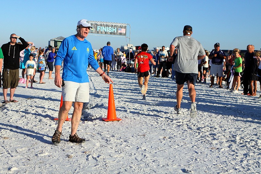 Dan Pollock encourages the runners to 