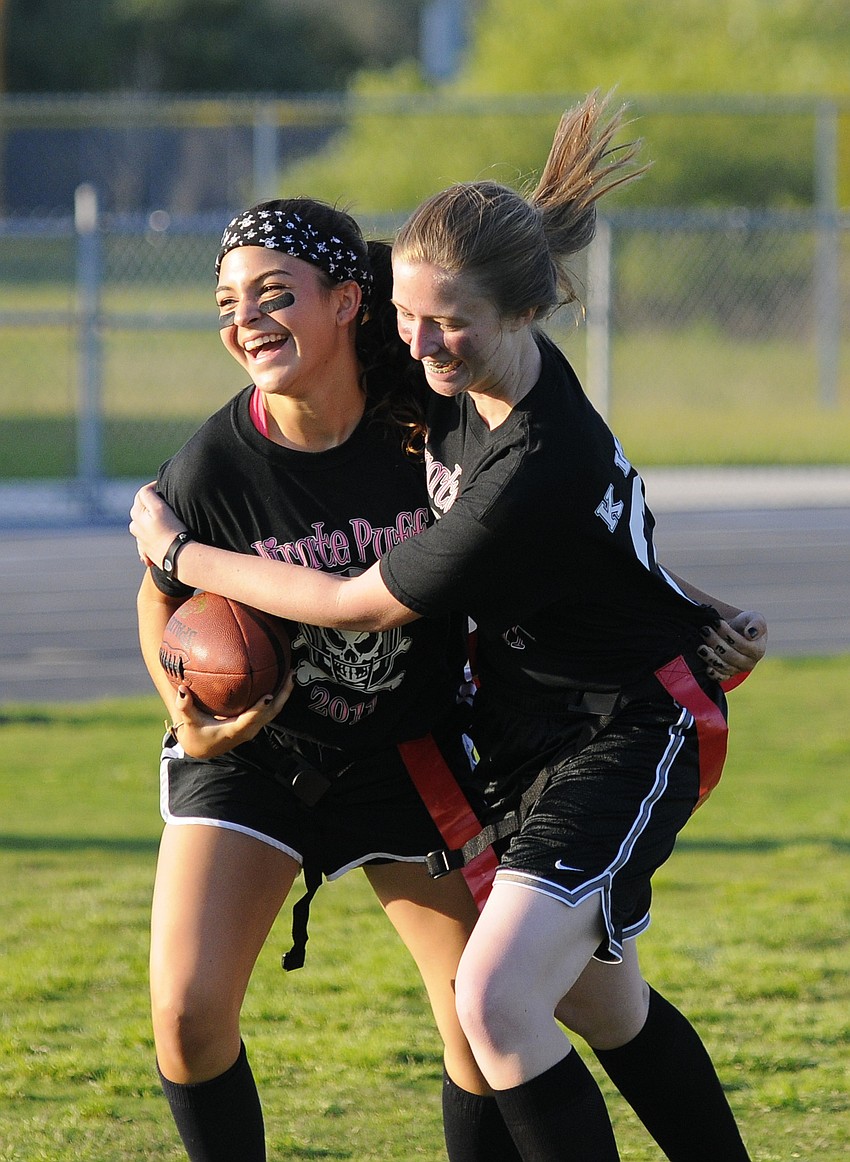Sophomore Brittany Rangel, left, celebrates with Kaylee Wells after scoring a touchdown.