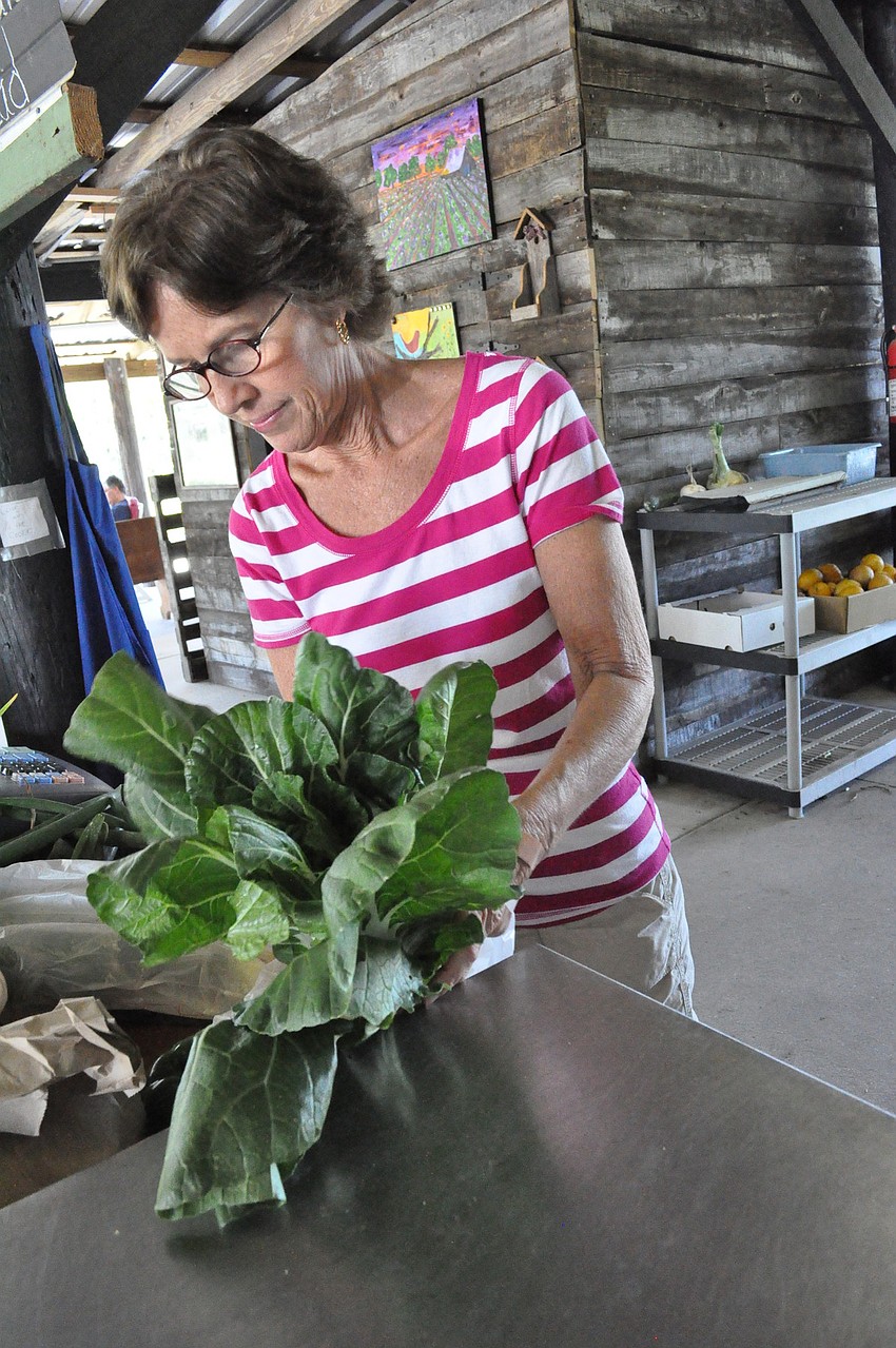 Jan Bell rings up fresh produce at the farm stand.