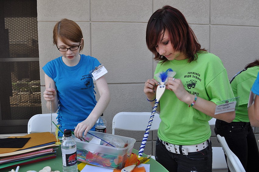 youthFEST volunteers Jess Groberg and Selene Moon man the craft table.