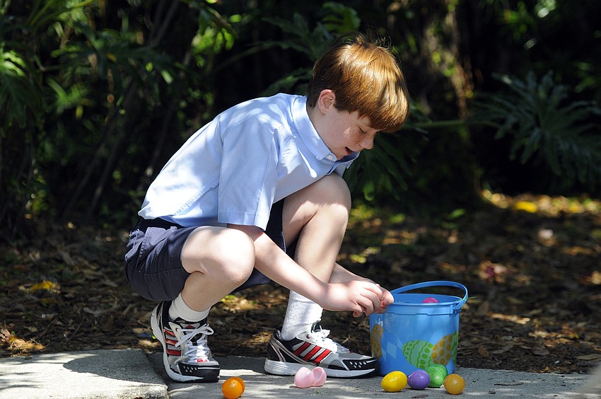Ten-year-old Max Kominowski took a quick peak inside some of his eggs before heading off to look for more.