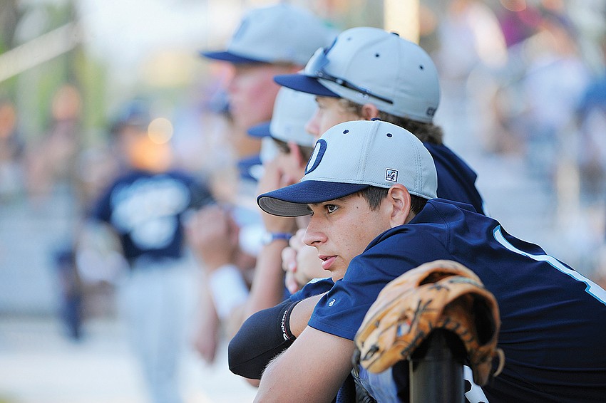 Members of the Out-of-Door Academy baseball team look on during the Class 2A-District 11 championship game April 28.