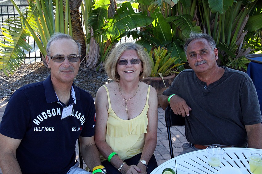 Louis and Clare Magliano with Joe Pratrco enjoy themselves Saturday, May 7 during the after party for the Sarasota Bay Cup at Bird Key Yacht Club.