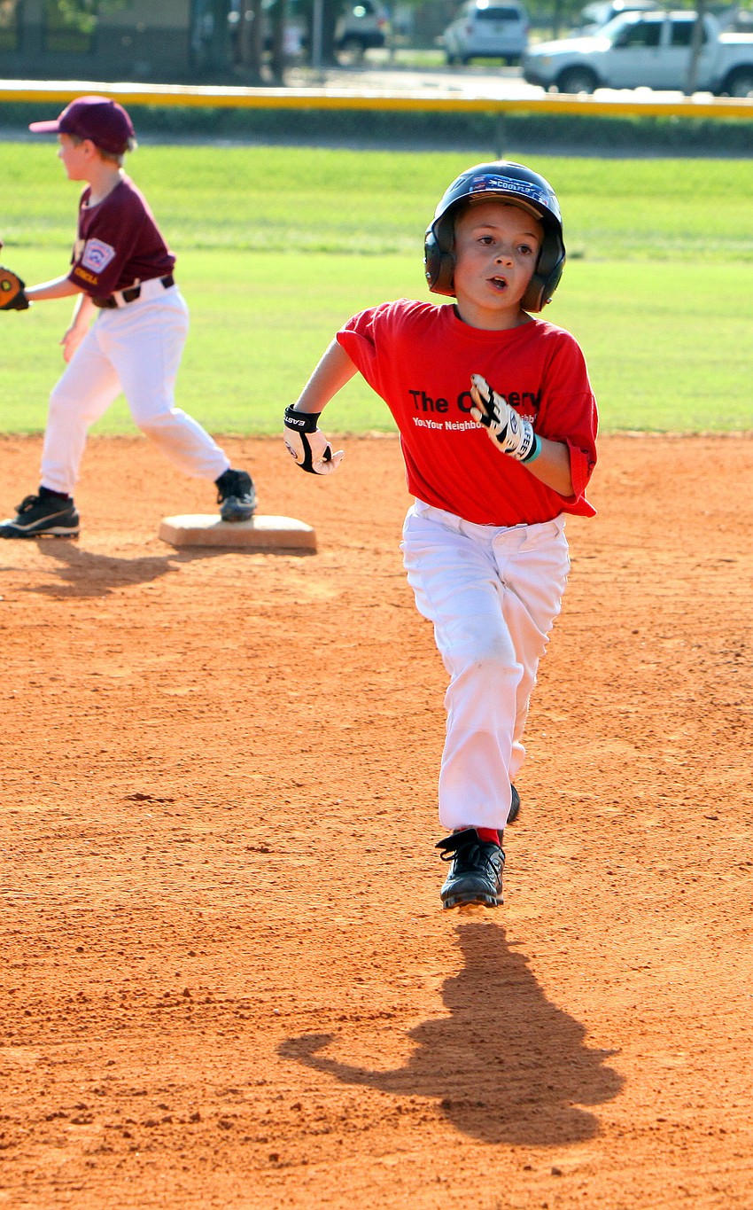 Dominic Cuffaro, #12, runs from second to third Monday, May 9 at Twin Lakes Park.