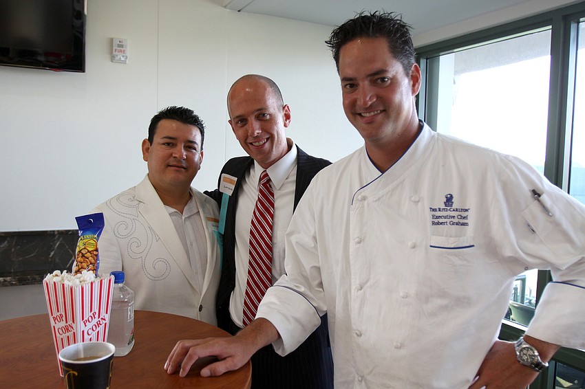 Cesar Ruiz, Scott Gentile and Robert Graham pose together at the 2011 National Tourism Week Awards ceremony Thursday, May 12, at Ed Smith Stadium.