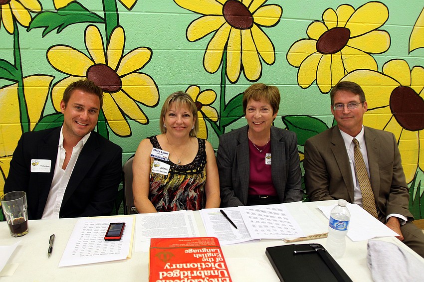 Reader Larry Bowman with judges Mary Lynn Dejarlais, Nora Patterson and Jack Pilkington at the Sarasota Kiwanis Club's Spelling Bee Friday, May 13 at the Boys and Girls Club.