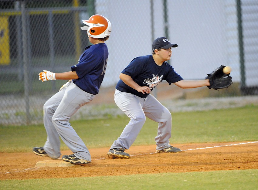 Nick Dimare beats the throw down to third base.