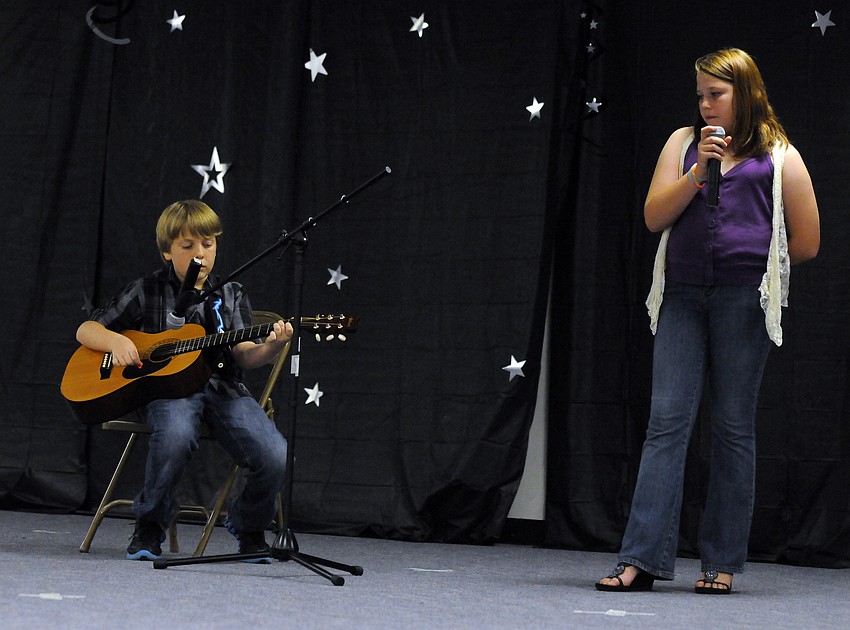 Kaylene Watson sang a song by Taylor Swift while Brendan Guyre accompanied her on guitar.