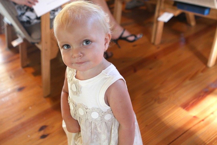 Mathilde Wesson, 17 months, keeps herself entertained by running around the chapel Friday, June 3 prior to ODA's 6th grade graduation at Siesta Key Chapel.