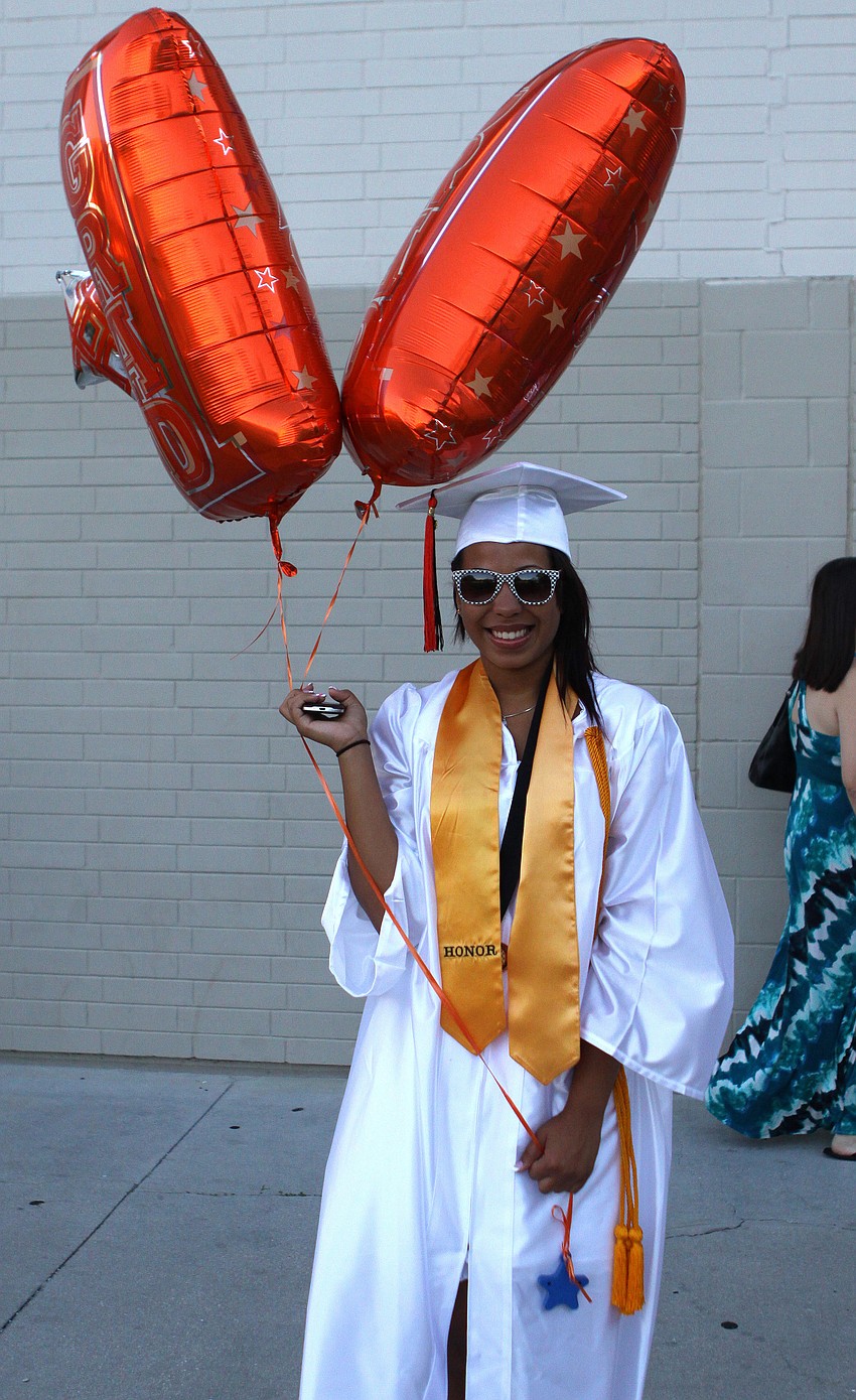 Olivia Morris poses with the balloons her friends and family gave her Friday, June 3 at Sarasota High School's graduation at Cleland Stadium.