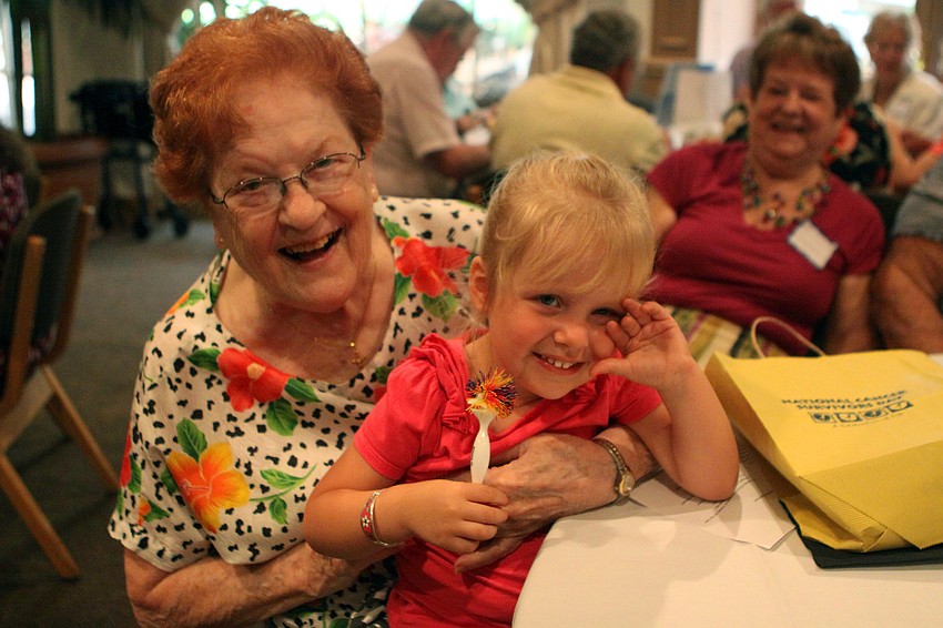 Alice Moubray holds her great-grand-daughter, Madison Slydel, 2, on her lap during the annual National Cancer Survivors Day celebration Sunday, June 5 at Michael's on East. Moubray has been cancer free for 14 years.