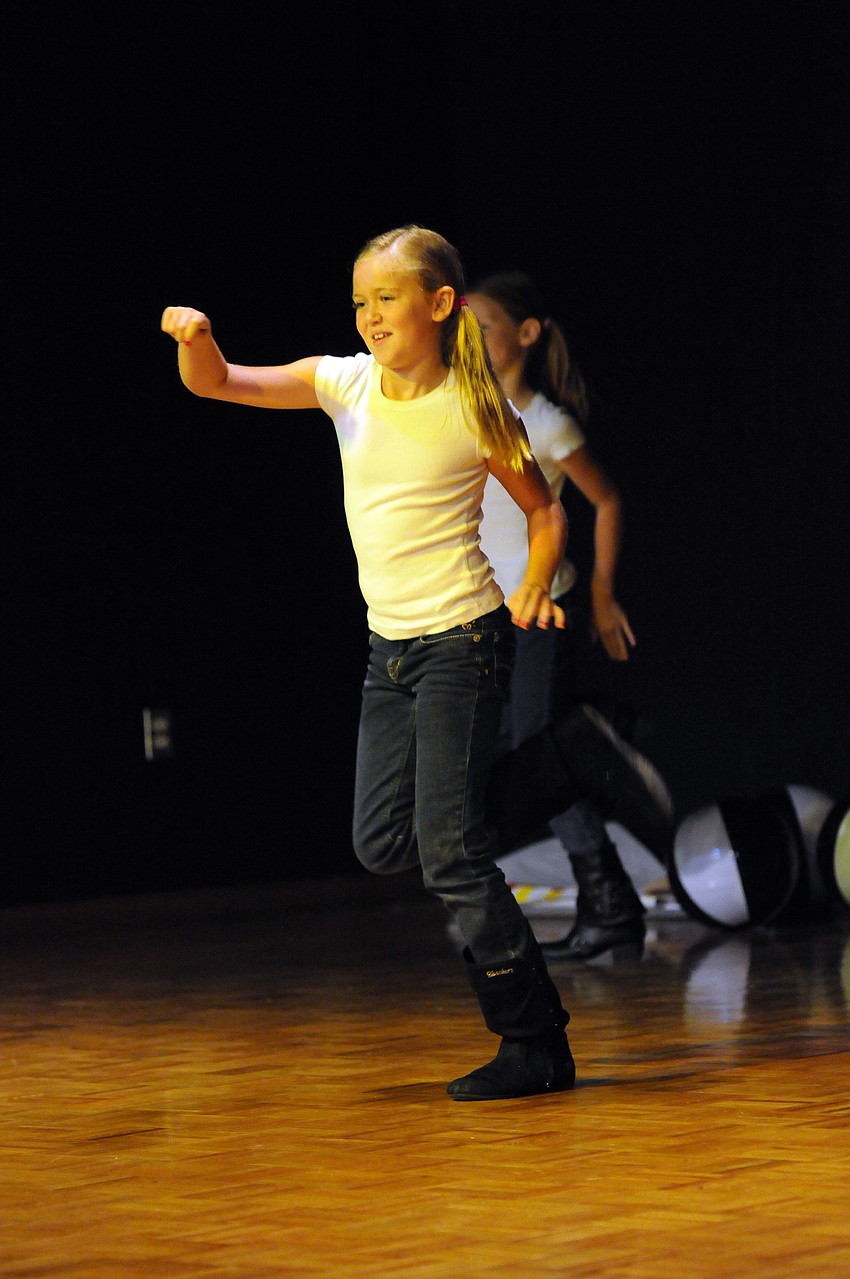 Third-grader Kali Reis was full of energy during her groupâ€™s country-themed dance routine.