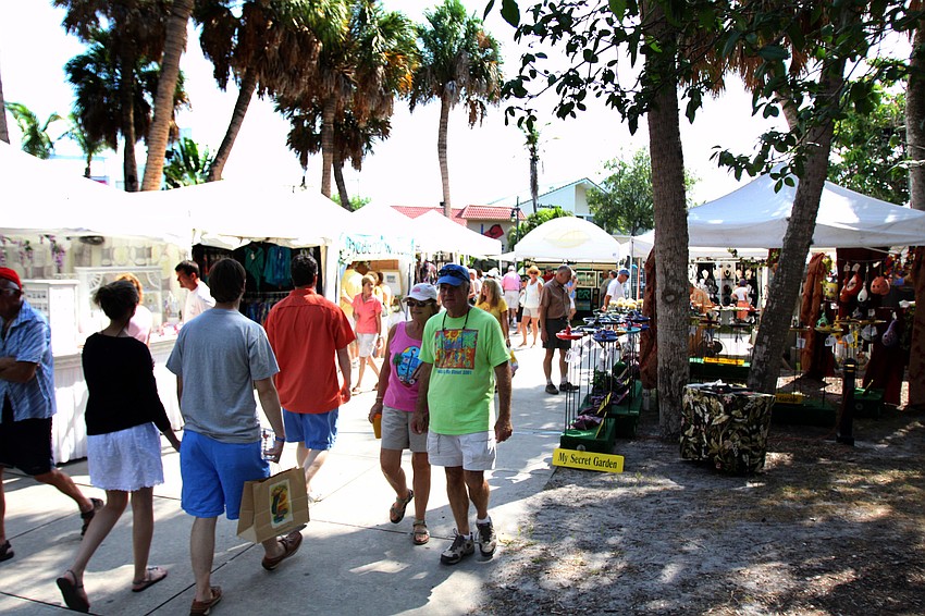People enjoy themselves at the 10th Annual St. Armands Craft Festival Saturday June, 11 at St. Armands Circle.