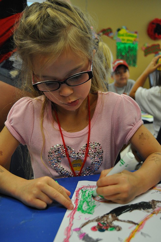 Savannah DiDomenico, 5, worked hard on her art project.