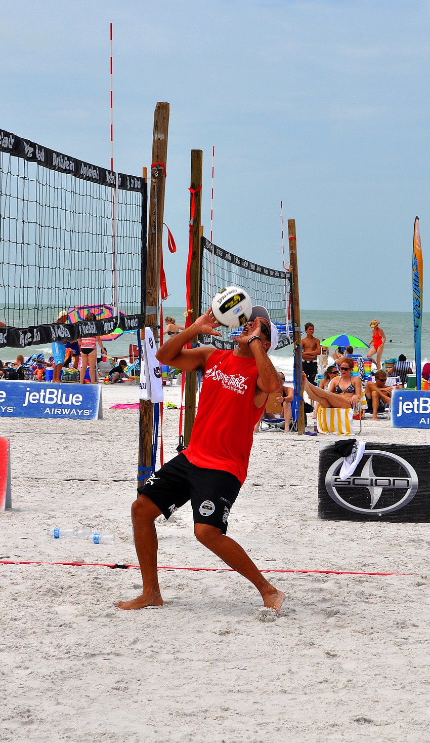 Adrian Carambula gets ready to set the ball for his teammate, Steve Grotowski, during the Siesta Key Gulf Open, Saturday, July 9 at Siesta Key Beach.