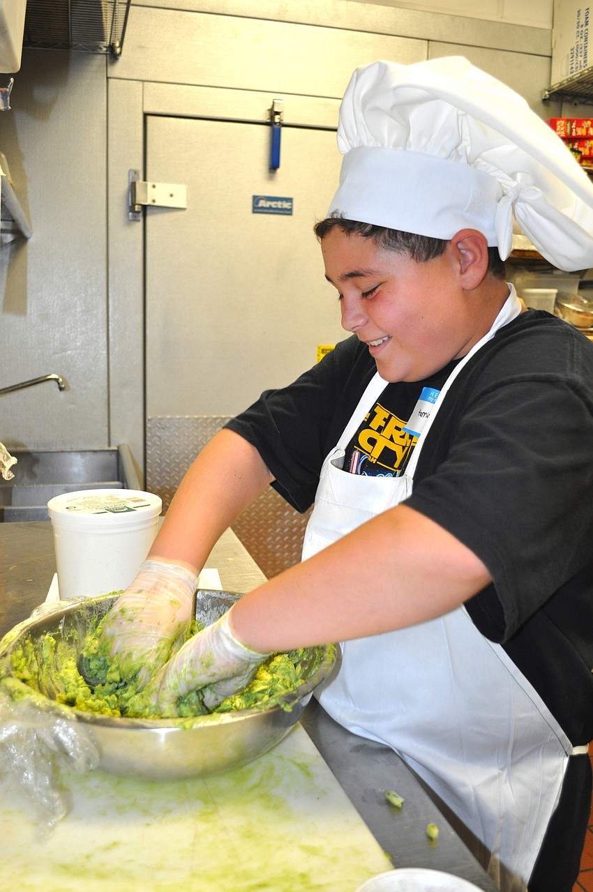 Harris Lichtenstein makes guacamole.