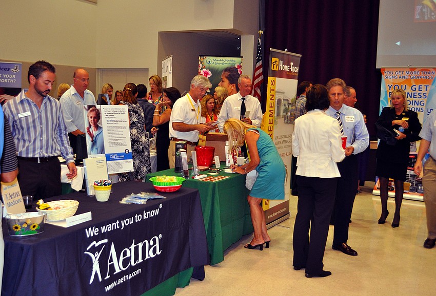 People mingle with one another Wednesday, July 13 during the Sarasota Prime Time event presented by The University of South Florida â€“ Sarasota Manatee at the Girl Scouts of Gulfcoast Florida.