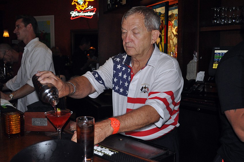 Sen. Mike Bennett was one of the celebrity bartenders who poured drinks for tips.