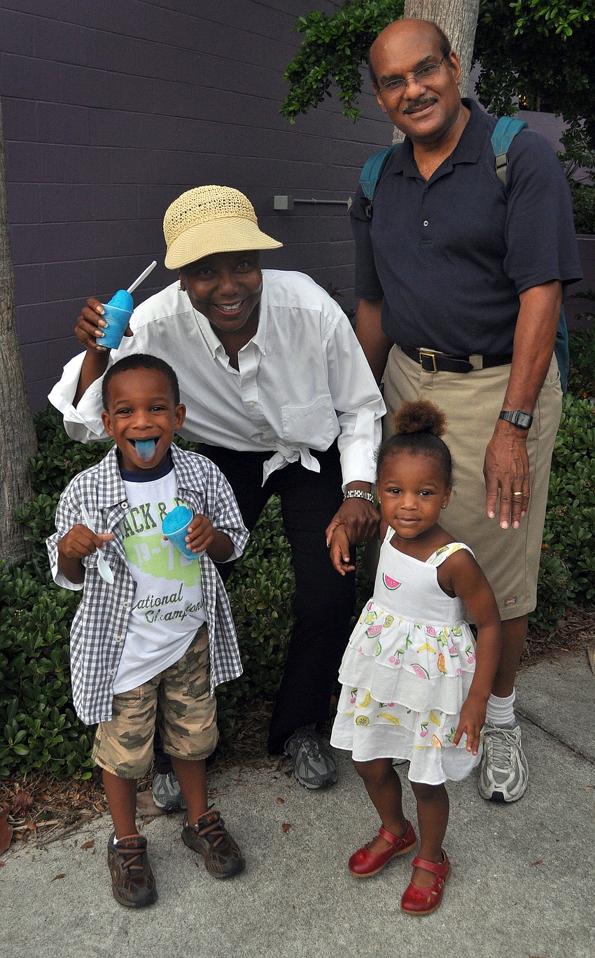 Hazel and David Farmer, Nana and Papa, pose with their grandchildren, Winston, 4, and Jane, 2, Cockburn Friday, July 15 at Friday Fest at the Van Wezel.