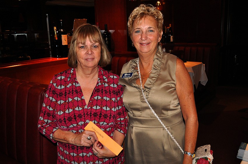 Helen Daruszka and Sandee Davis pose together Thursday, July 28 at the LLSA luncheon at Fleming's.