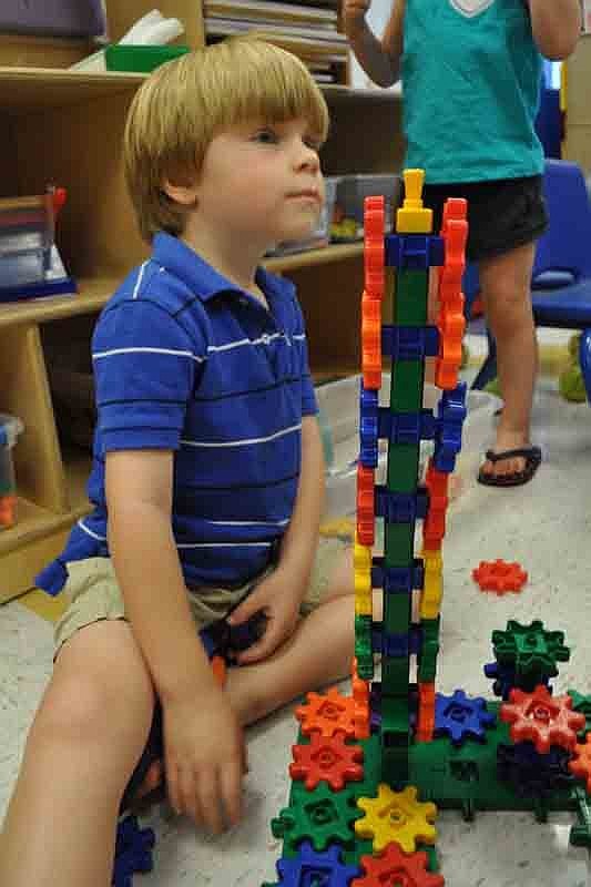 Emerson Eige, 4, had fun doing some construction while waiting for story time to start.