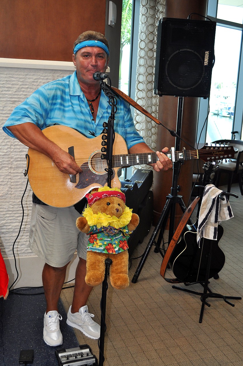 Jimmy Bones sang and played his guitar along with his sidekick â€œBare Bonesâ€ Saturday, August 6 during Scallopalooza at the Sarasota Yacht Club.